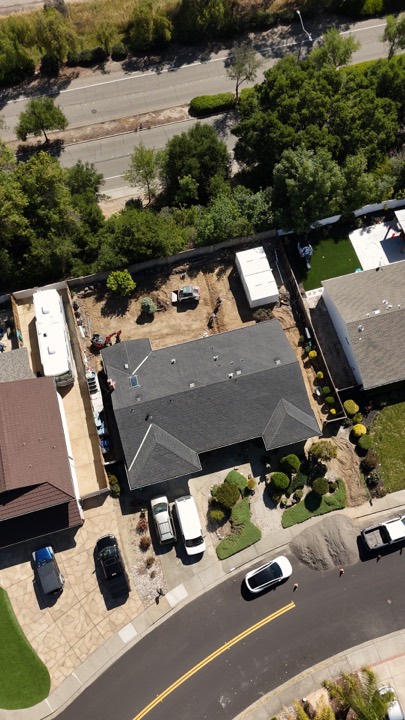 Aerial view of a residential property and street