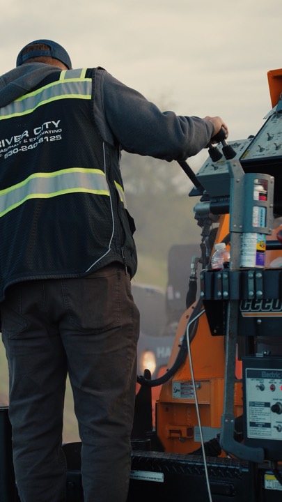 Operator running a paving machine